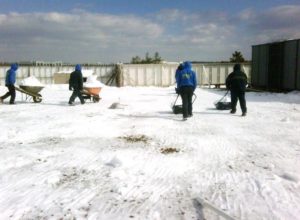 shoveling snow from commercial roof
