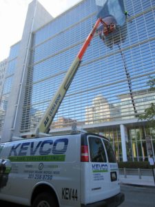 kevco installing a banner