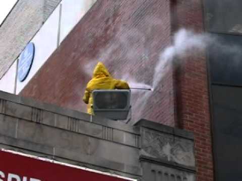 pressure cleaning a brick building