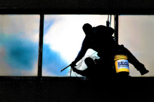 KEVCO window washer cleaning a window