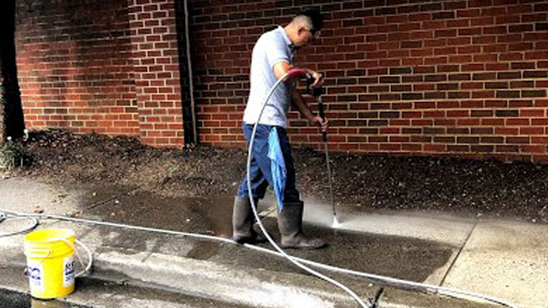 pressure washing a sidewalk